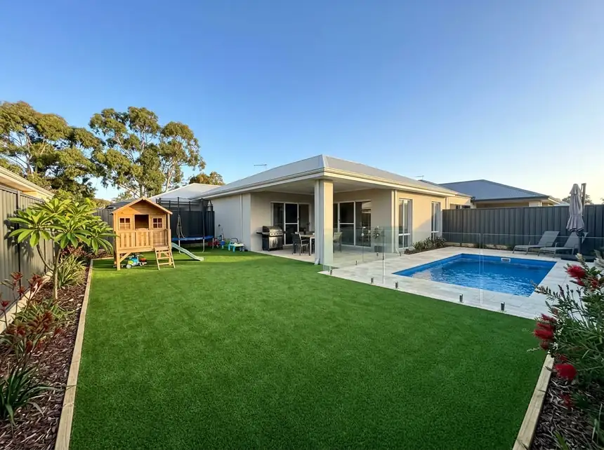Artificial grass Mandurah — family backyard with pool and play area